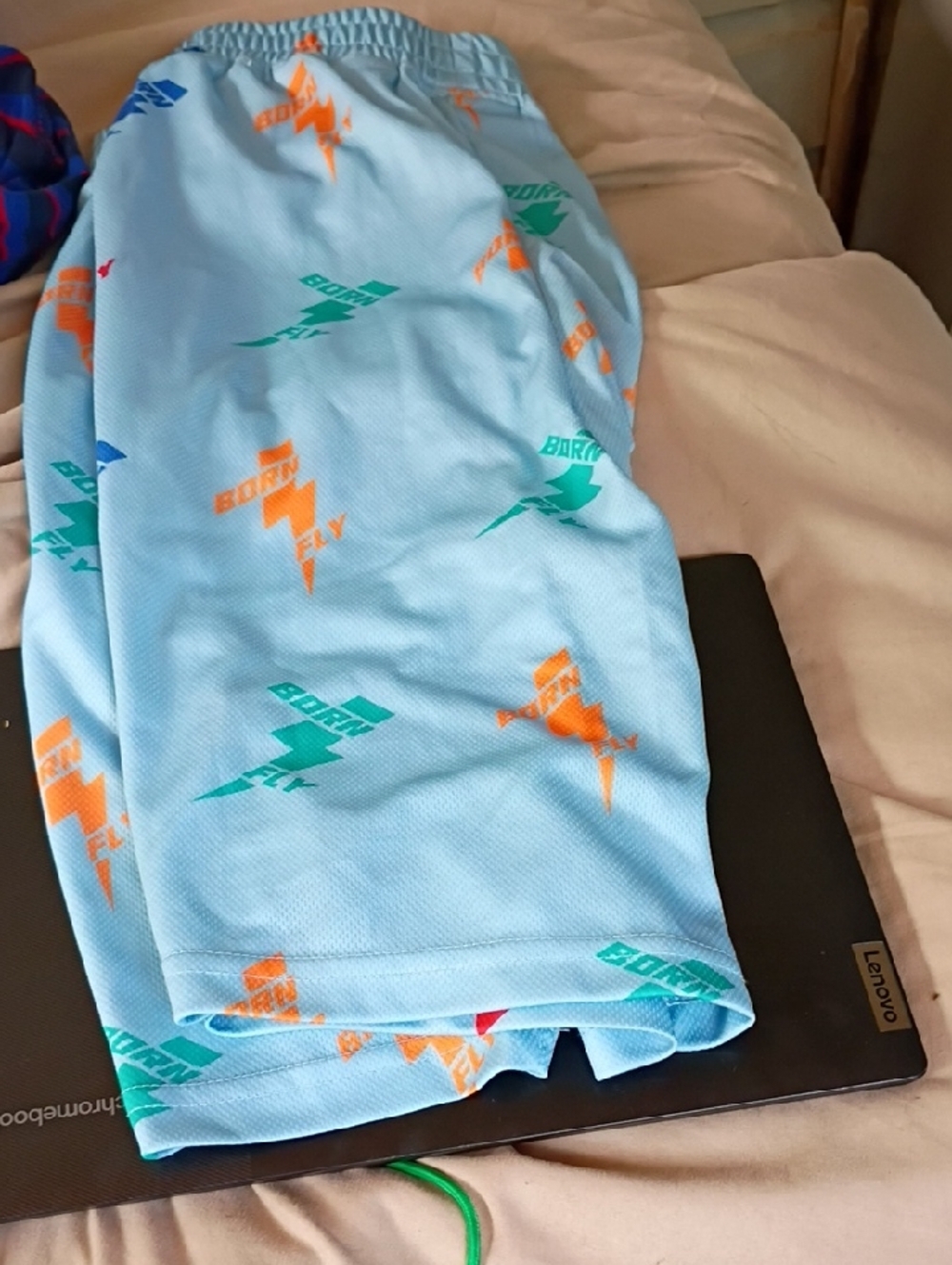Sky Blue Athletic Shorts with Orange & Teal Lightning Logos Born Fly Shorts